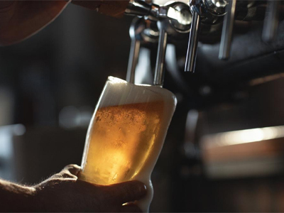 A pint being poured, photographed for The Plough Inn’s existing website